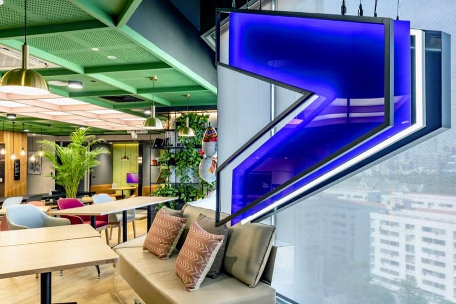 Branded workplace interior with illuminated environmental graphics
